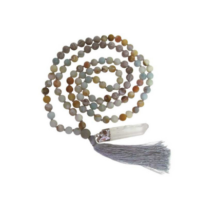 Multicolored beaded necklace with a tassel on a white background